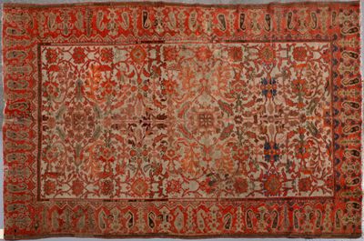 tapis persan ancien à motif floral sur fond rouge