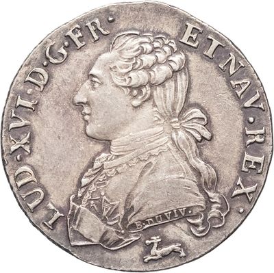 une pièce d'argent représentant le portrait d'un homme de profil