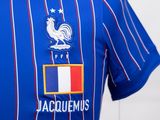 a close up of a soccer shirt with a french flag on it