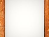 an old wooden frame with a white background in the middle of it