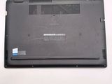 a laptop that has a broken battery on the back of it