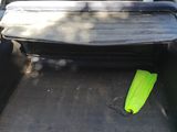 a car that has a surfboard in the back of it