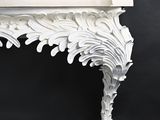 a close up of a white table with a black background