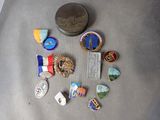 a lot of pins and a coin on a table