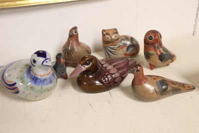 a lot of birds that are sitting on a table
