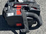 an image of a corded blower sitting on the ground