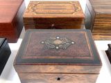 four wooden boxes that are sitting next to each other