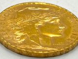 an image of a gold coin with a woman ' s face on it