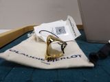 a pair of glasses sitting on a bag next to a wallet
