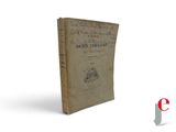 an old book sitting on top of a table next to a white background