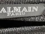 the label on the back of a black suit is clearly visible