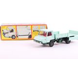 a toy truck that is sitting next to a box