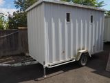 a trailer with a trailer attached to it in a parking lot