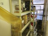 a yellow ribbon hanging from a shelf in a room