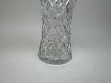 a glass vase that is sitting on a table
