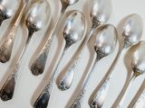 a lot of spoons that are sitting on a table