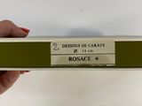 someone is holding a box with a bunch of scissors in it