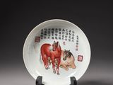 a plate with a painting of a horse and a dog on it