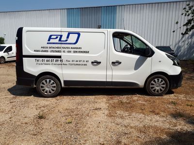 a white van that is parked in front of a building
