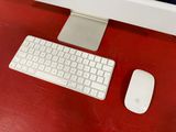 a keyboard and mouse on a desk next to a monitor
