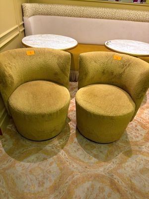 two chairs and a table in the corner of a room