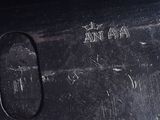 a close up of a metal object with writing on it