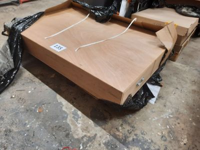 a box that is sitting on the ground next to a black bag