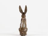 bronze sculpture of a rabbit sitting on its hind legs