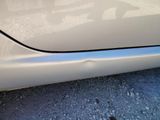 a close up of a car ' s door handle with a sticker on it