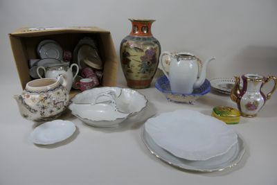 many different types of dishes and cups on the table