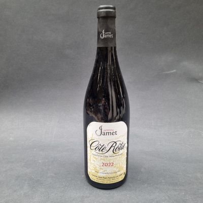 a close up of a bottle of wine on a table