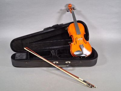 a violin in a case with a violin stick in it
