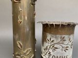 pair of antique brass vases with decorative designs on them