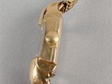 an image of a gold necklace with a phone attached to it