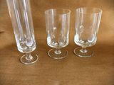 three empty wine glasses sitting on a table