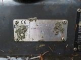 a close up of a metal plate on a machine
