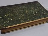 an old book sitting on top of a table