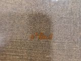 a close up of a piece of wood with a brown stain