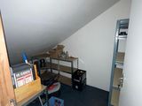 an image of a room with a ladder and shelves