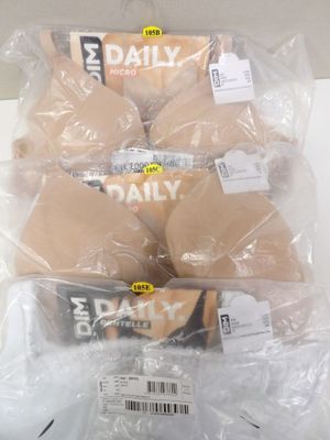 a pile of cookies wrapped in plastic bags on a table