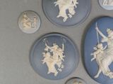 four blue and white plates with different designs on them