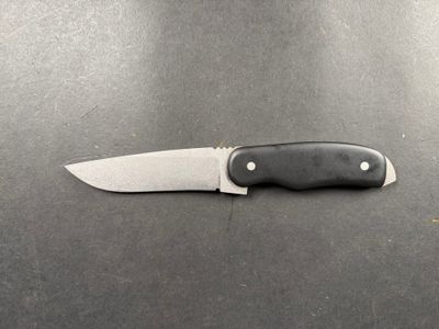 a knife that is laying on top of a table