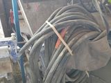a pile of hoses sitting on the floor in a garage