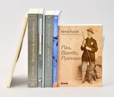 three books that are sitting next to each other on a table
