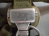 a close up of a metal watch on a strap