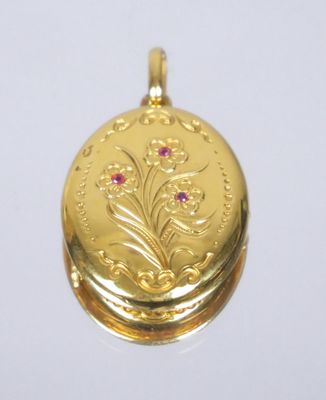 a gold locke with a flower design on it