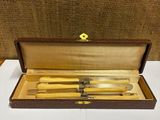 a wooden box with two knives and a fork in it