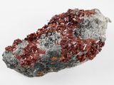 a close up of a rock with a red substance on it