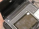 two laptops and a tablet on the ground