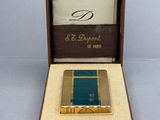 a small box with a lighter in it on a table